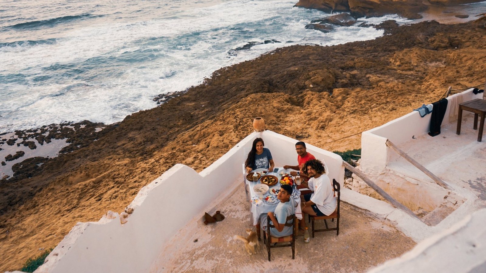 Family dinner on the Ajarif terrace above the ocean near the Timlalin dunes