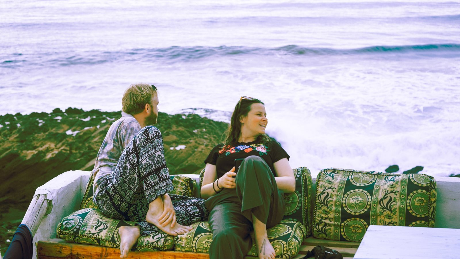 Guests relaxing on the Ajarif terrace overlooking the ocean
